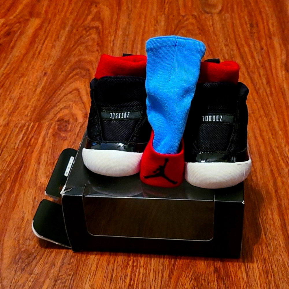 Jordan 11 Crib Bootie size 2C black,white, and red